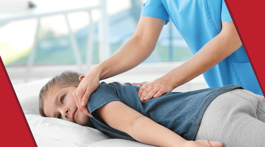 chiropractor aligning child's spine
