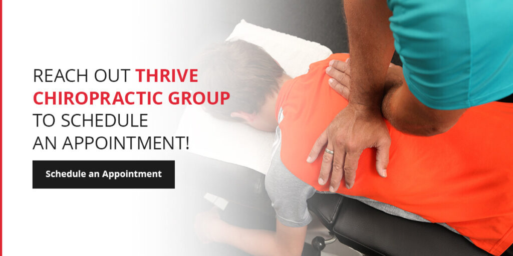 chiropractor re-aligning patient